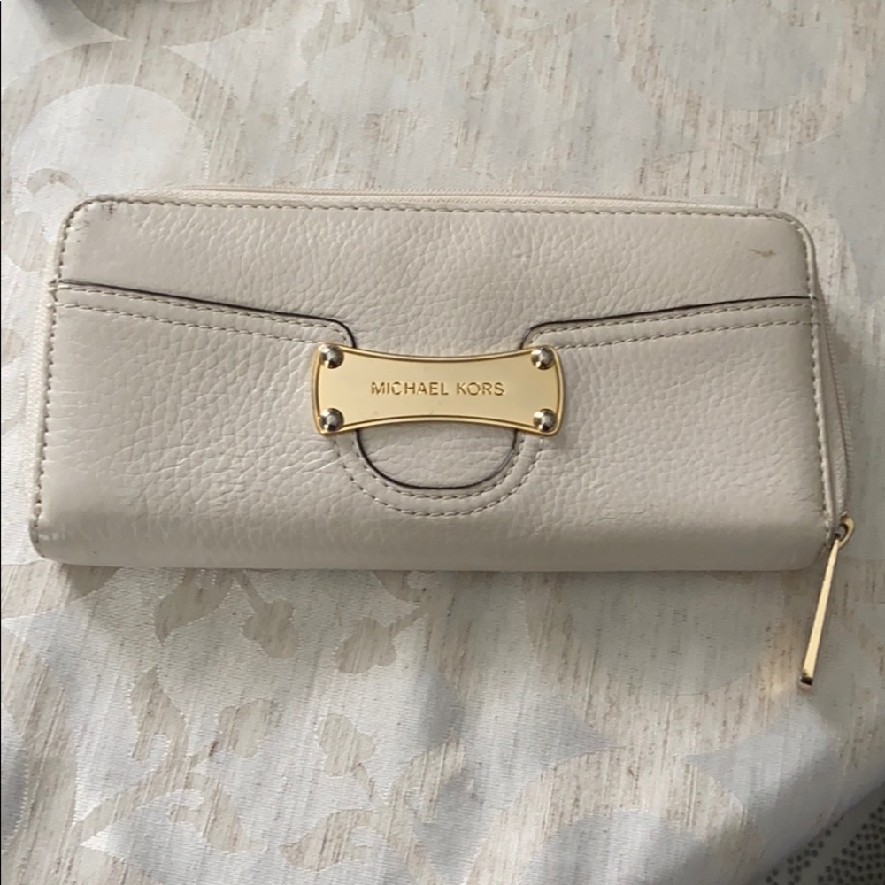 Michael Kors cream wallet.